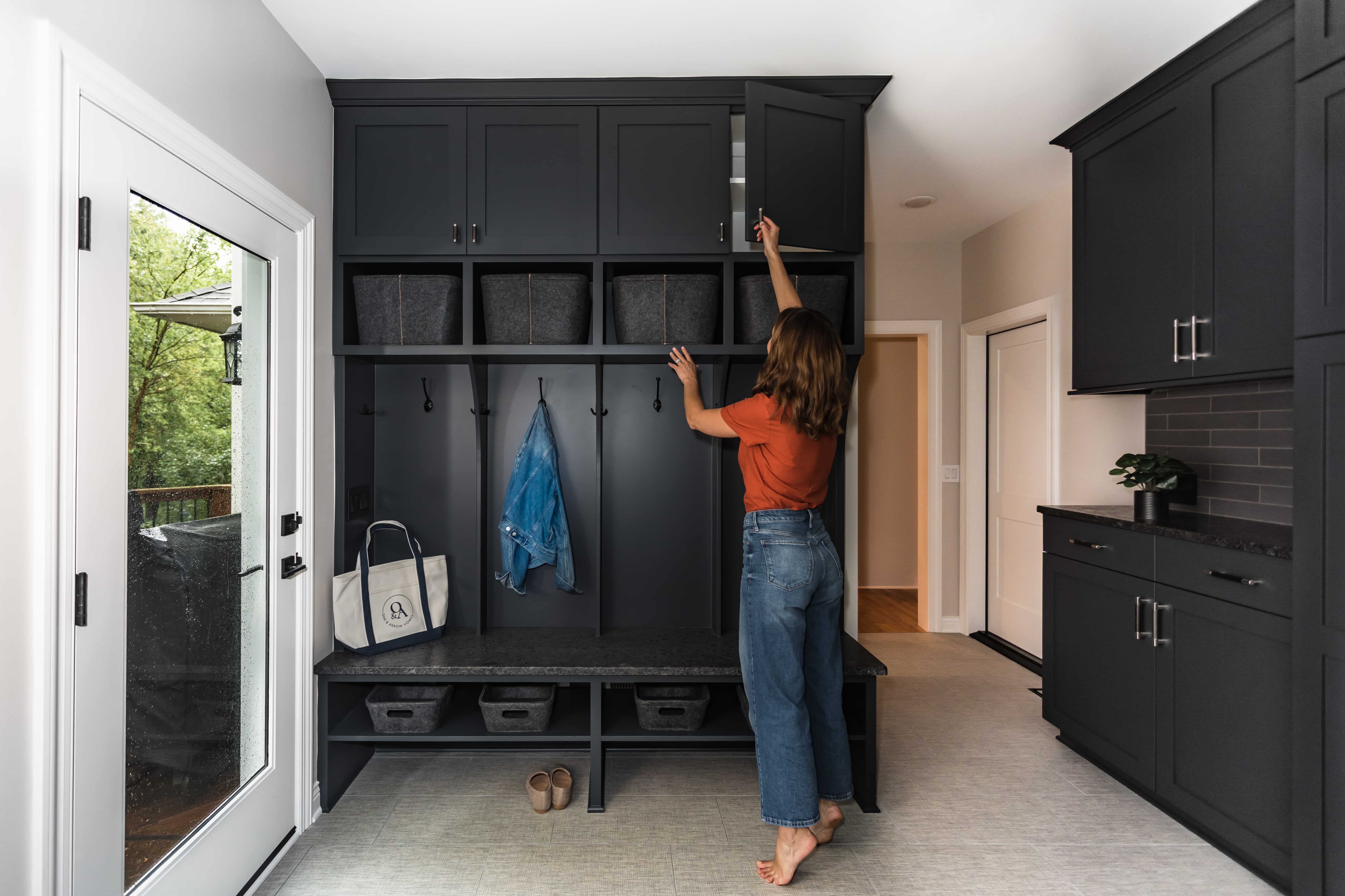 Charcoal mudroom built-in with bench cubbies tile floor